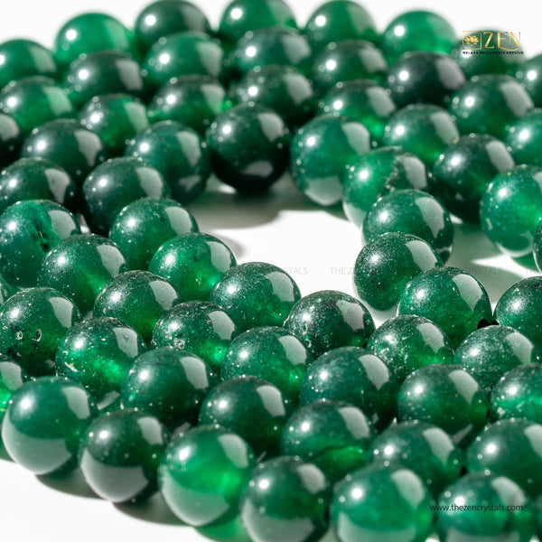 Close-up of green beads on a white background with 'ZEN' branding.
