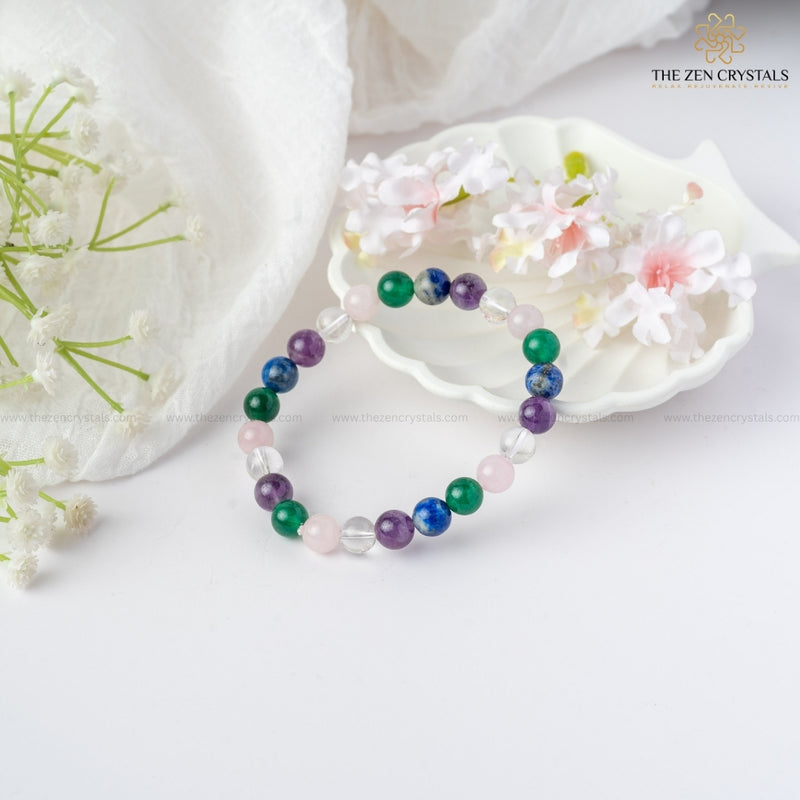 Focus & Clarity Energy In Studies Bracelet on a white surface with flowers and 'The Zen Crystals' branding.