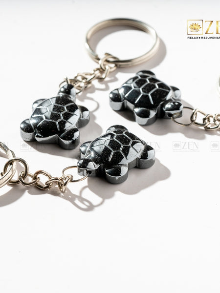 Natural Hematite Turtle Keyring attached to a key set, perfect for carrying positive energy daily.