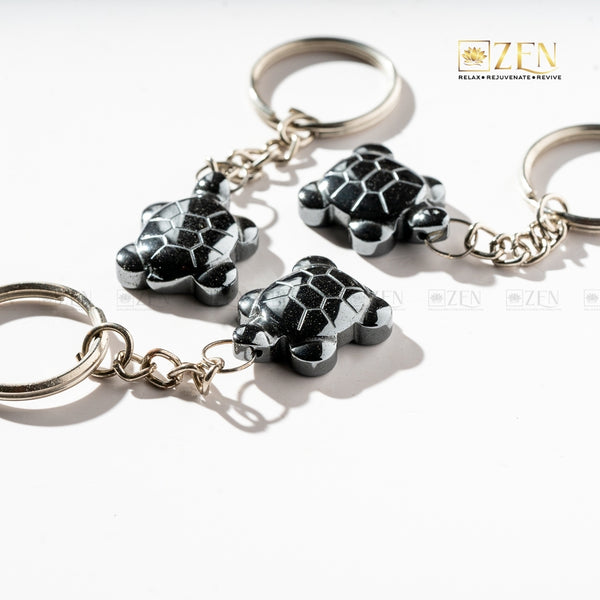 Natural Hematite Turtle Keyring attached to a key set, perfect for carrying positive energy daily.