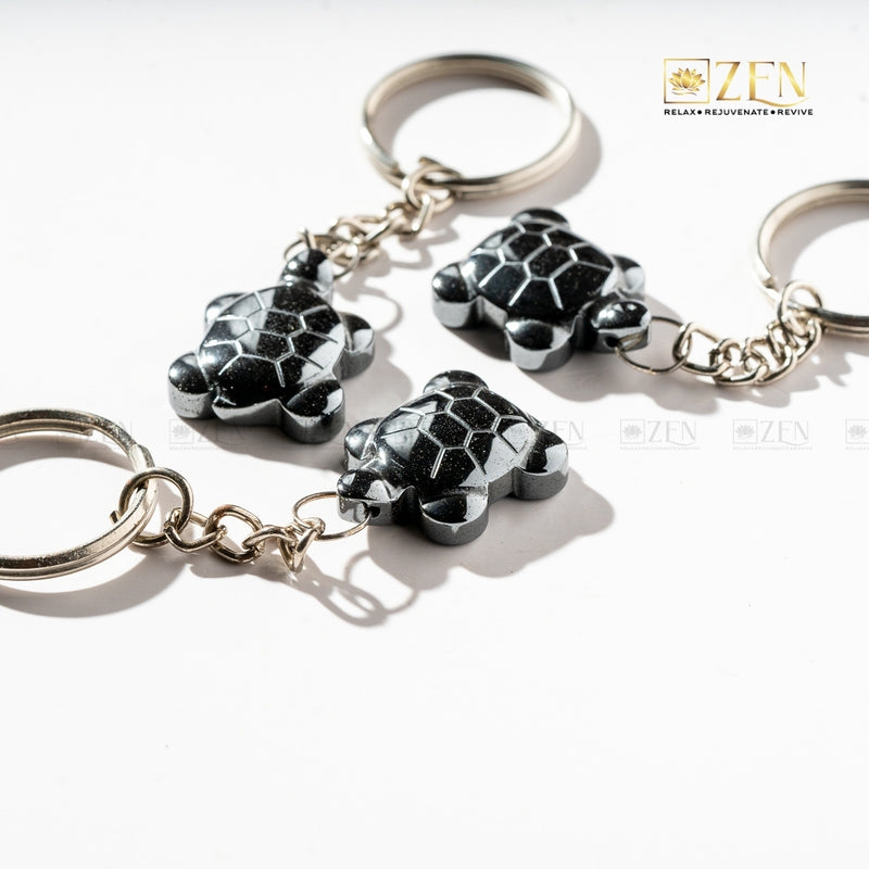 Natural Hematite Turtle Keyring attached to a key set, perfect for carrying positive energy daily.