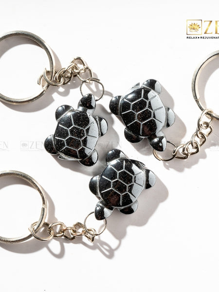Hematite Turtle Keychain with metallic shine, symbolizing wisdom, stability, and emotional balance.