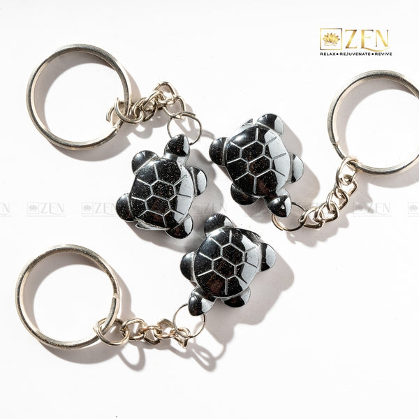 Hematite Turtle Keychain with metallic shine, symbolizing wisdom, stability, and emotional balance.