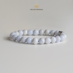 Blue lace agate bracelet on a light gray background with 'The Zen Crystals' logo.