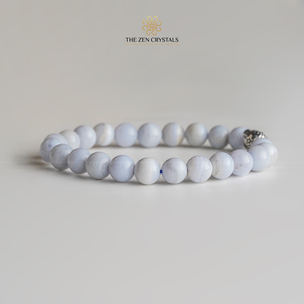 Blue lace agate bracelet on a light gray background with 'The Zen Crystals' logo.
