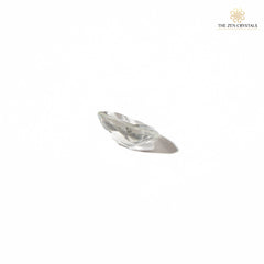 Clear quartz side view crystal on a white background with 'The Zen Crystals' logo.