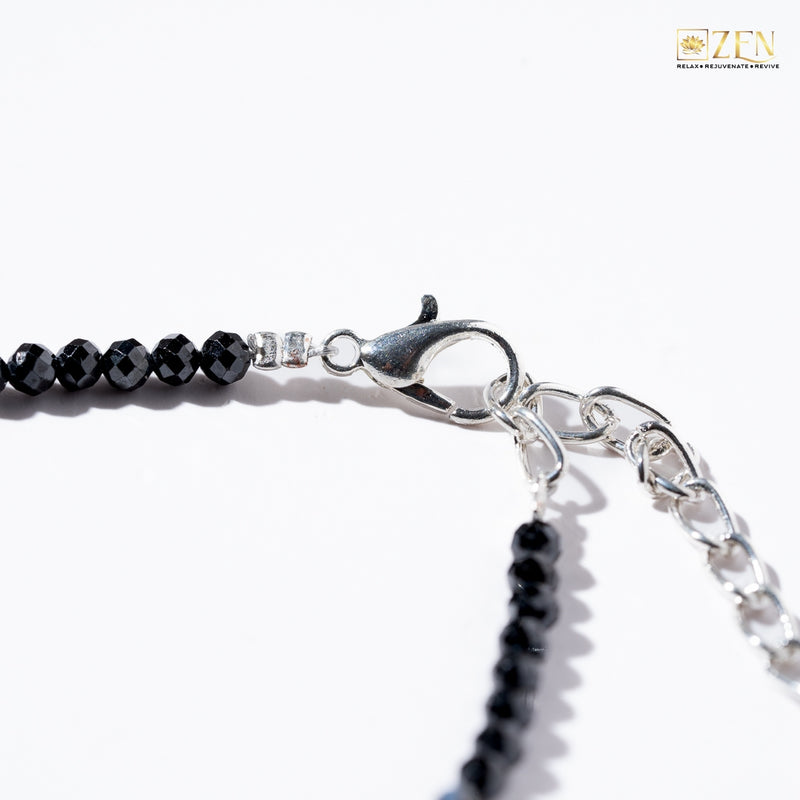Close-up of a black obsidian anklet adjustable hook
