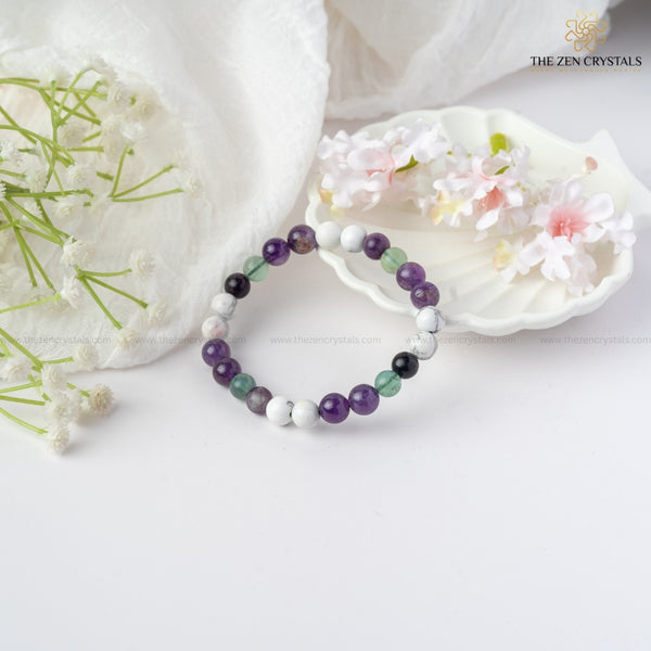 clarity of thoughts bracelet on a white surface with decorative elements.