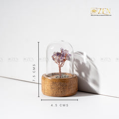 Decorative tree in a glass dome on a wooden base with measurements.