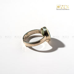 Silver ring of Malachite gemstone on a white background with 'Zen' brand logo.