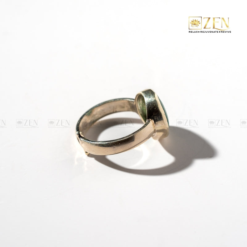 Silver ring of Malachite gemstone on a white background with 'Zen' brand logo.