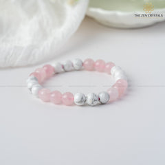 Love Energy Bracelet with pink and white beads on a light background, branded 'The Zen Crystals'.