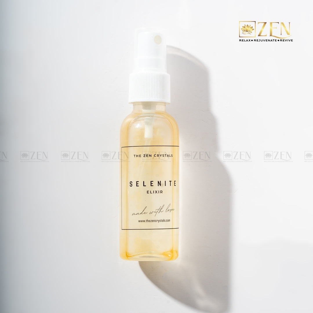 Selenite Elixir space cleansing spray bottle with natural selenite chunks inside