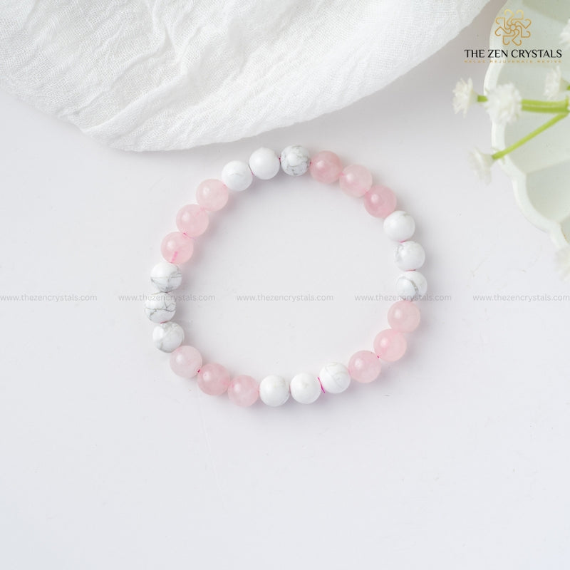 Love Energy Bracelet with pink and white beads on a light background, branded 'The Zen Crystals'.