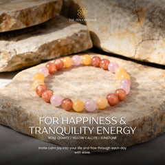 happiness and tranquility bracelet on stones with 'The Zen Crystals' branding and energy text.