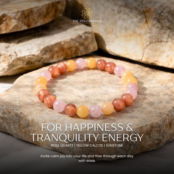 happiness and tranquility bracelet on stones with 'The Zen Crystals' branding and energy text.