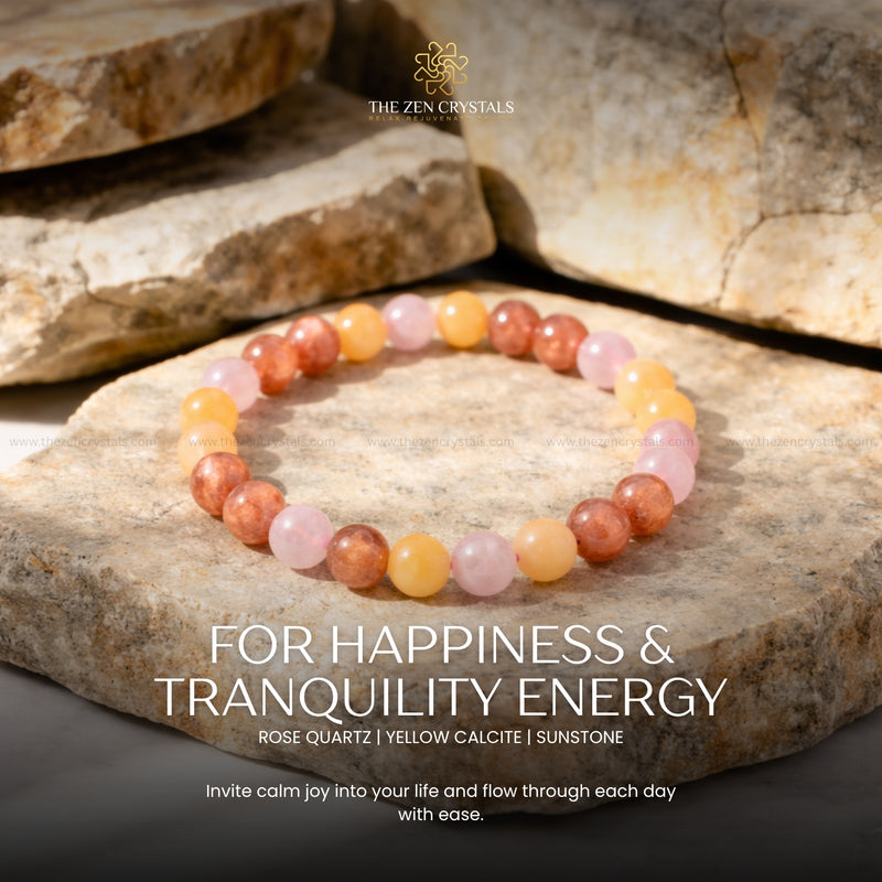 happiness and tranquility bracelet on stones with 'The Zen Crystals' branding and energy text.