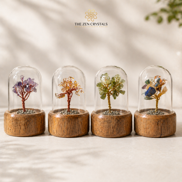 Four decorative trees in glass domes on a neutral background with 'The Zen Crystals' logo.