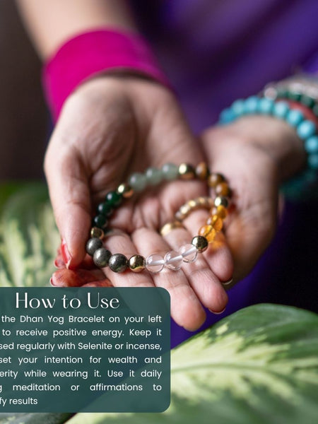 Hands holding a Dhan Yog Bracelet with instructional text overlay on a leafy background
