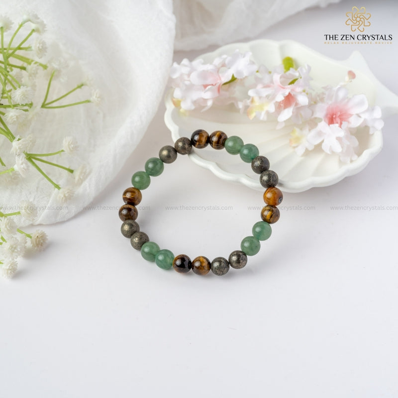 Business Success Energy Bracelet on a white surface with flowers and 'The Zen Crystals' branding.