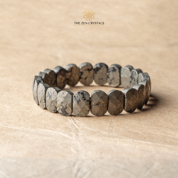 Pyrite flat bead Bracelet made of natural stone beads on a beige background with 'The Zen Crystals' branding.