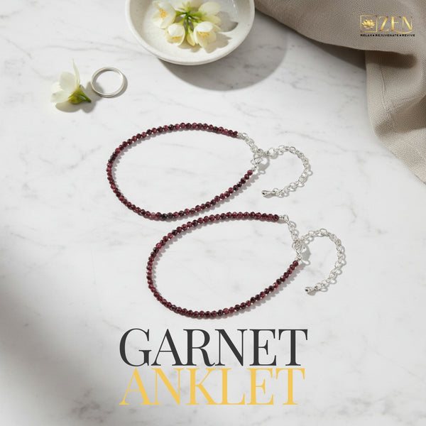 Pair of Garnet Anklet displayed on a marble slab, highlighting minimal design and premium red garnet beads.