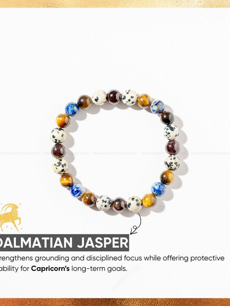 capricorn zodiac bracelet with Dalmatian Jasper stones on a white background with gold border
