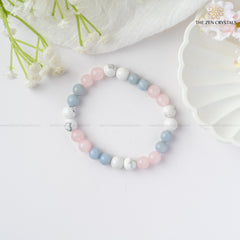 peaceful meditation bracelet with pastel colors on a white surface with flowers