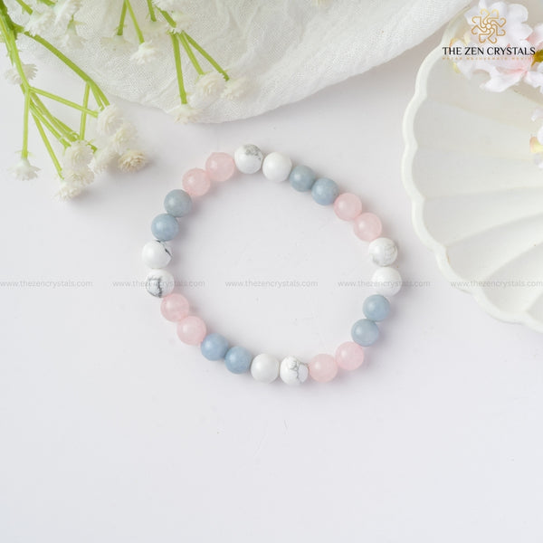 peaceful meditation bracelet with pastel colors on a white surface with flowers