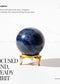 Sodalite sphere crystal on a stand with promotional text and branding.