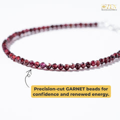 Close-up of faceted red garnet beads in the Garnet Anklet, known for vitality, confidence, and inner strength.