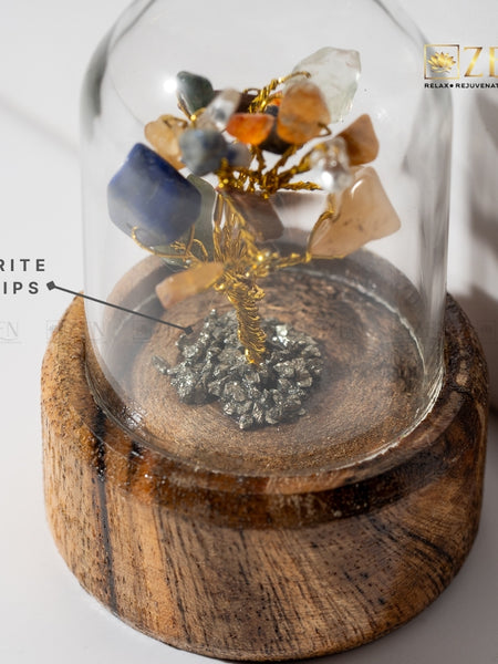 Crystal tree with pyrite chips and stones on a wooden base