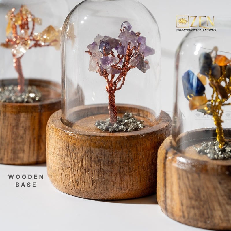 Decorative tree with crystals on a wooden base under a glass dome by The Zen Crystals