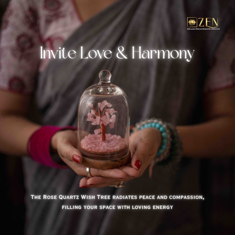Person holding a glass dome with a rose quartz wish tree, promoting love and harmony.