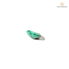 Green malachite stone on a white background with 'The Zen Crystals' logo.