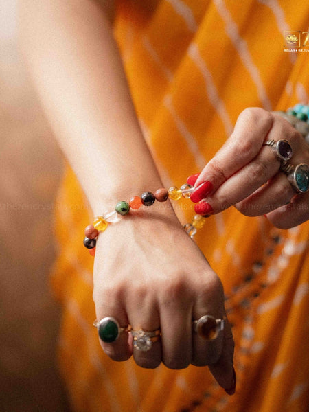 close up of a hand wearing the zen crystals ruling number 1 bracelet