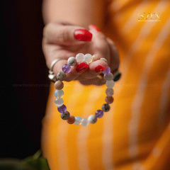 Colorful beaded bracelet on a hand with a blurred background