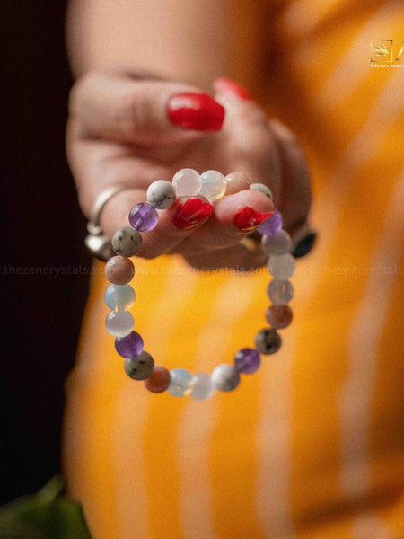 Colorful beaded bracelet on a hand with a blurred background