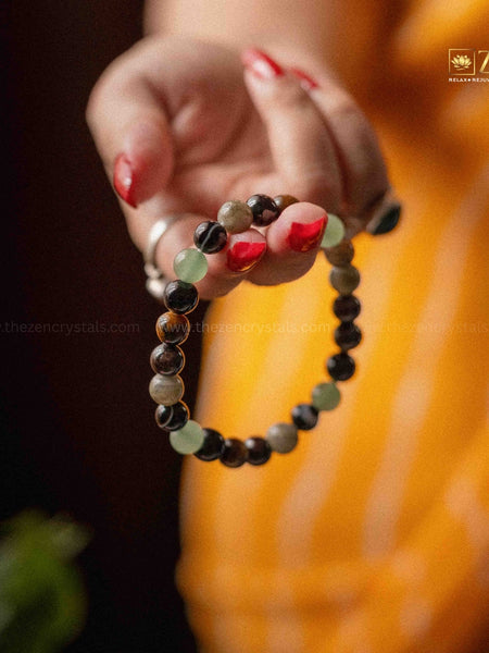 a hand holding ruling number 4 bracelet 