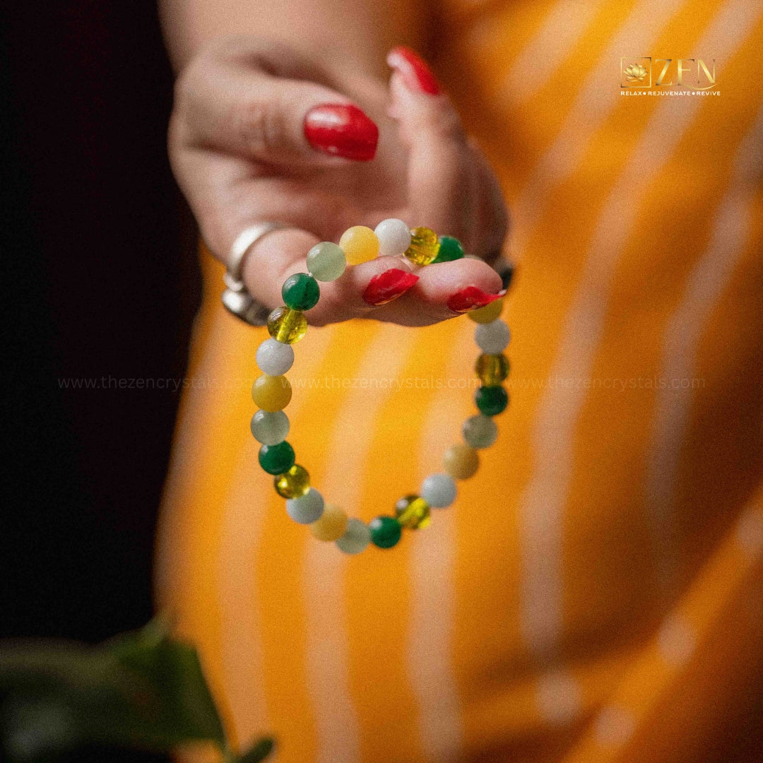 close-up image of a hand holding the rulingn number 5 bracelet