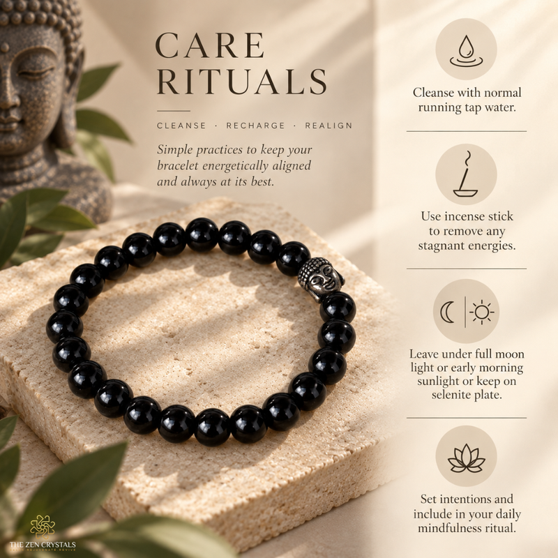 A black obsidian bracelet with a silver-toned Buddha head charm is displayed on a stone pedestal with care ritual text and icons on a beige background.