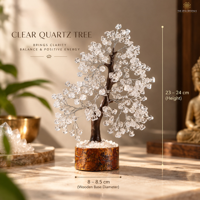 A decorative crystal tree centerpiece made of clear quartz stones on a dark brown wooden base, shown on a tabletop in a warm indoor setting with text indicating height 23-24 cm and base diameter 8-8.5 cm.