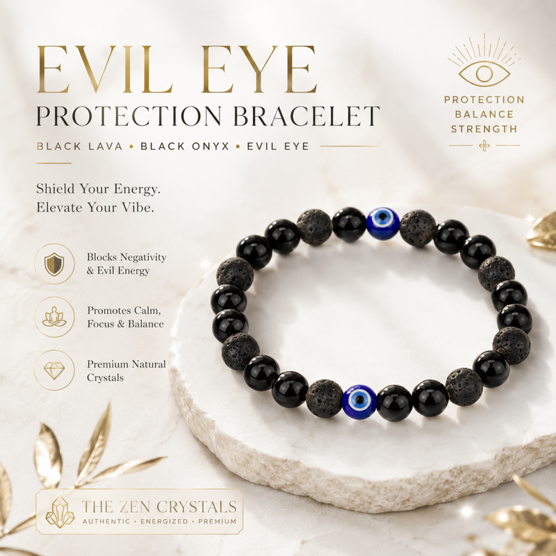Evil Eye bracelet displayed on a white stone slab. The bracelet features glossy black lava stones and a central blue evil eye charm.