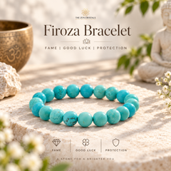 A turquoise beaded bracelet displayed on a stone pedestal with decorative props including a bronze bowl, a small statue, and flowers. Text at the top reads 'The Zen Crystals Firoza Bracelet' and icons at the bottom mention fame, good luck, and protection.