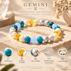 A beaded gemstone bracelet displayed on a stone surface, with the brand name Gemini and marketing text above it. The bracelet contains round beads in turquoise blue, white with gray veining, pale yellow, and translucent light blue.