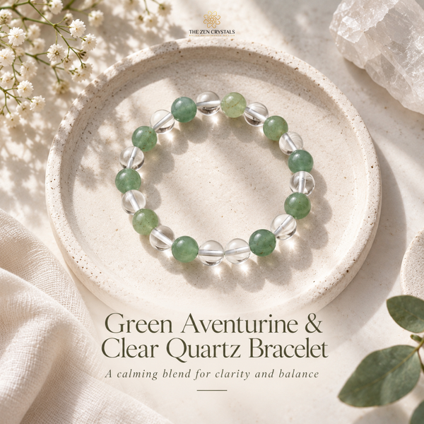 A beaded bracelet made of green aventurine and clear quartz stones, displayed on a round beige ceramic dish. The image is styled with white flowers, linen fabric, and a crystal cluster, with text at the bottom reading 'Green Aventurine & Clear Quartz Bracelet'.