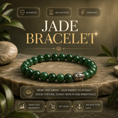 A green jade beaded bracelet with a silver-toned Buddha head charm, displayed on a stone slab with decorative leaves and rocks. The image features promotional text overlays including 'JADE BRACELET' and 'WEAR TRUE GREEN - JADE ENERGY TO ATTRACT GOOD FORTUNE, STEADY WEALTH AND INNER PEACE.