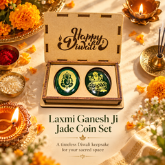 A Diwali-themed product presentation showing an open wooden box containing two green round keepsake coins with gold illustrations. The box lid is engraved with 'Happy Diwali' and the coins are labeled 'Laxmi Ganesh Ji Jade Coin Set.