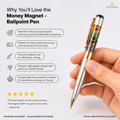 A hand holding a metallic ballpoint pen with a green and gold crystal cluster tip, shown on a light gray promotional graphic with text callouts and a quote.