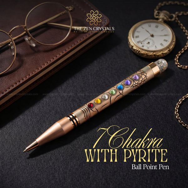 7 chakra ballpoint pen with chakra stones on a dark surface with 'The Zen Crystals' branding.
